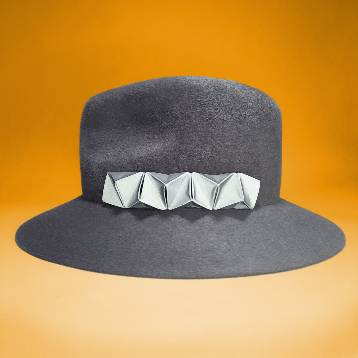 Grey velour felt fedora with a reflective chameleon detail that can be easily changed to customize your hat in a few seconds.
